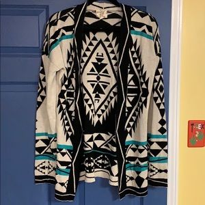 Cream and black cardigan with teal accents